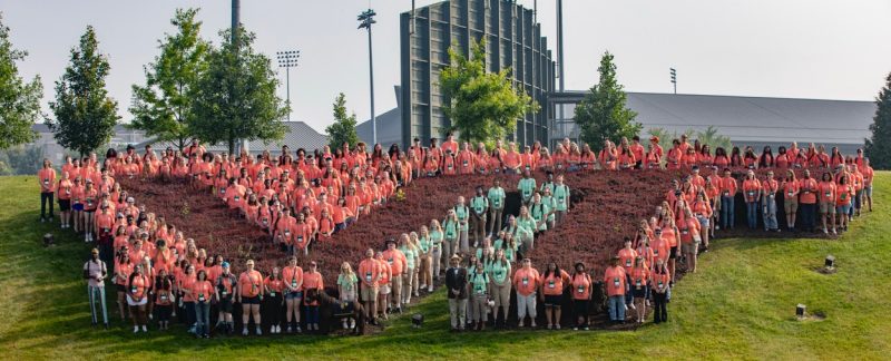 Virginia 4-H in front of the VT shrubbery 