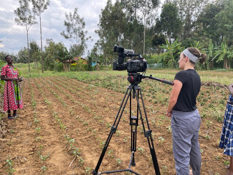 Videographer in a field