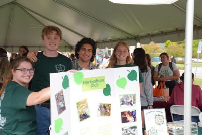 A group photo of students holding a "Horticulture Club" poster