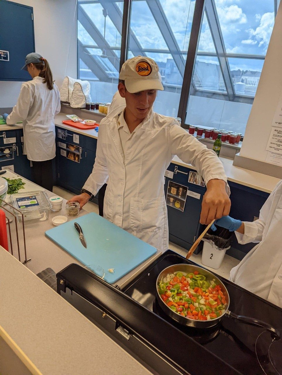 Student cooking vegetables