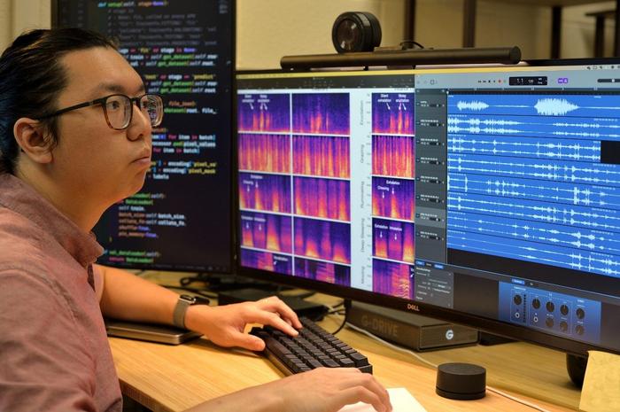 Man at computer screens