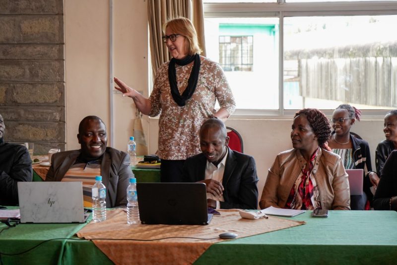 Patricia Raun giving presentation to room of APECS fellows