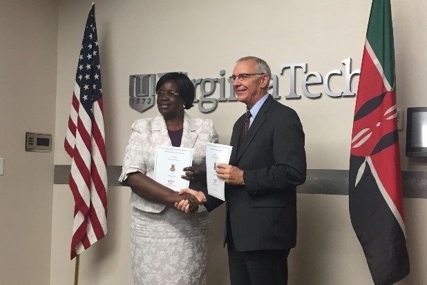 Rose Mwonya, Vice-Chancellor of Egerton University and Provost Cyril Clarke celebrating the signing of a new MOU between the universities.